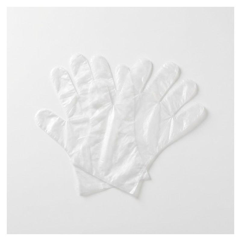 Guantes de polietileno transparentes superpuestos sobre fondo blanco